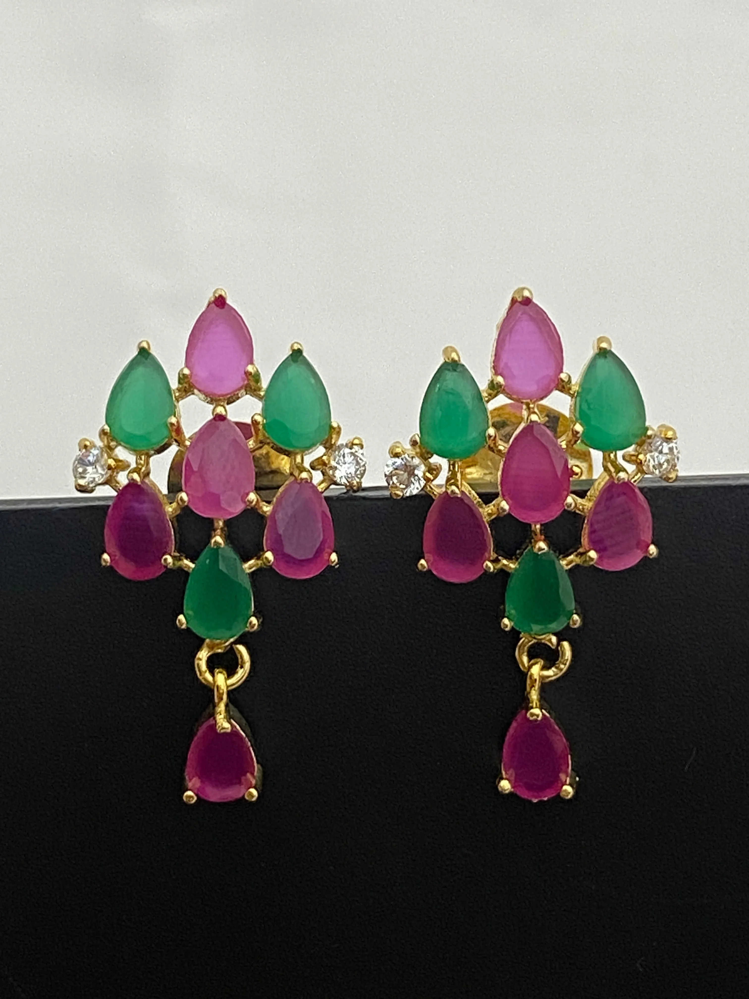 Beautiful Ruby And Emerald Color Party Wear Studded Earrings With Tear Drops