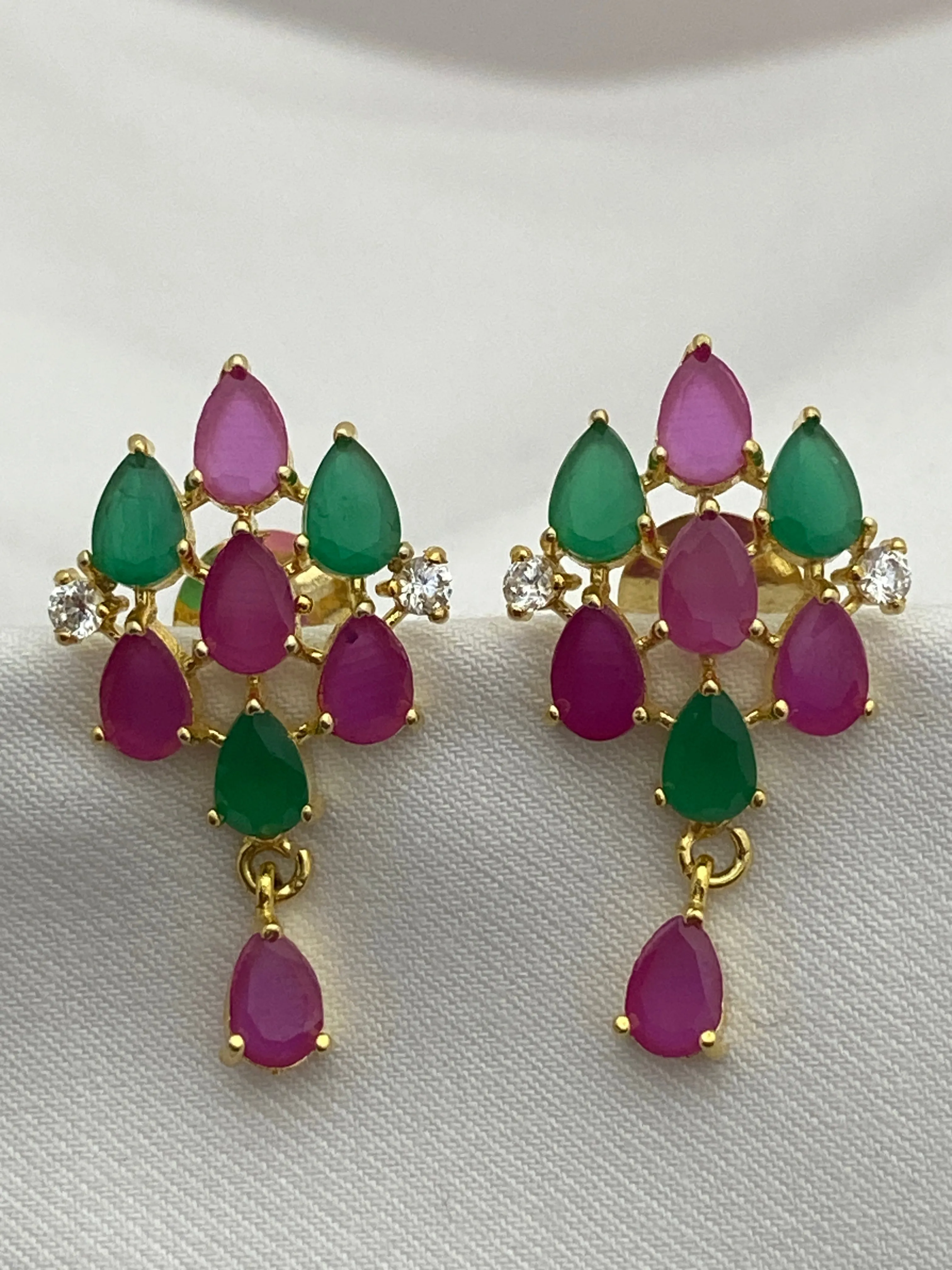 Beautiful Ruby And Emerald Color Party Wear Studded Earrings With Tear Drops